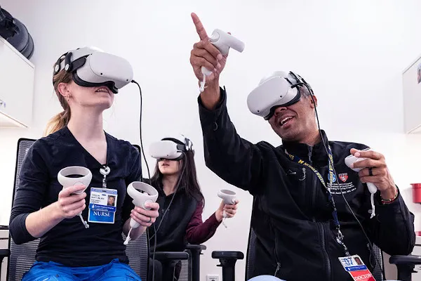 Clinicians wear VR headsets during educational exercise